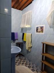 Large covered patio with vintage furniture on country estate Pajonal Penonomé Panama