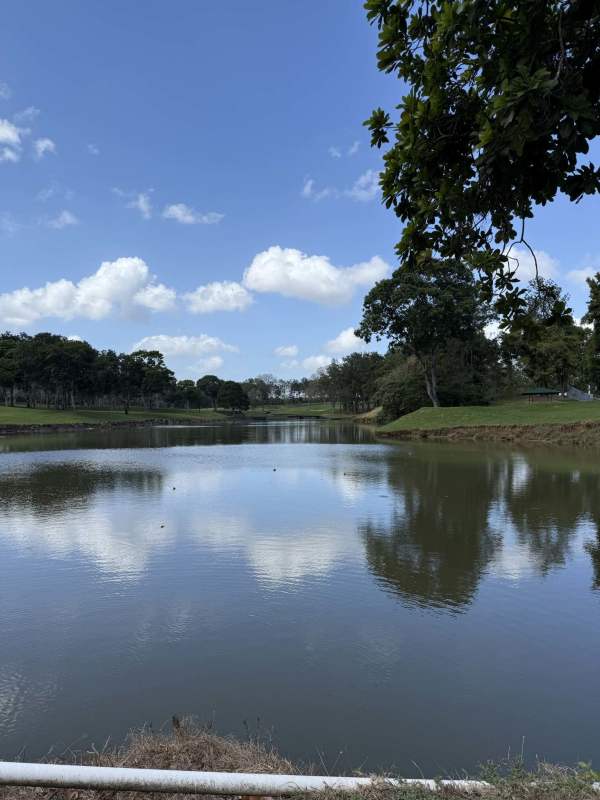 Modern kitchen with orange cabinets stainless steel oven in Golf Club house Panama