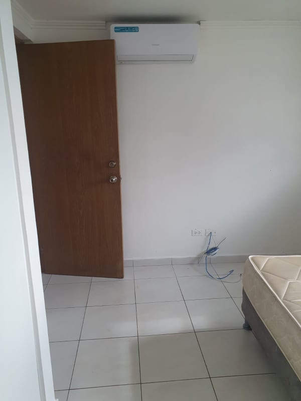 Modern bathroom with pedestal sink walk-in shower tile walls PH Limberg Tower Llano Bonito Panama