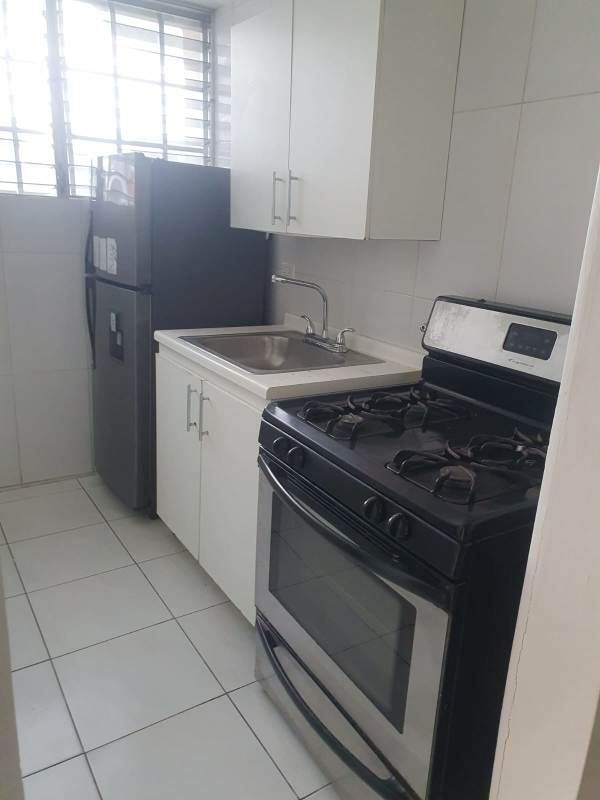 Bedroom with ceramic tile flooring and large window PH Limberg Tower Llano Bonito rental