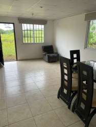 Open living dining space with bright windows tile floors in Mystic City La Chorrera