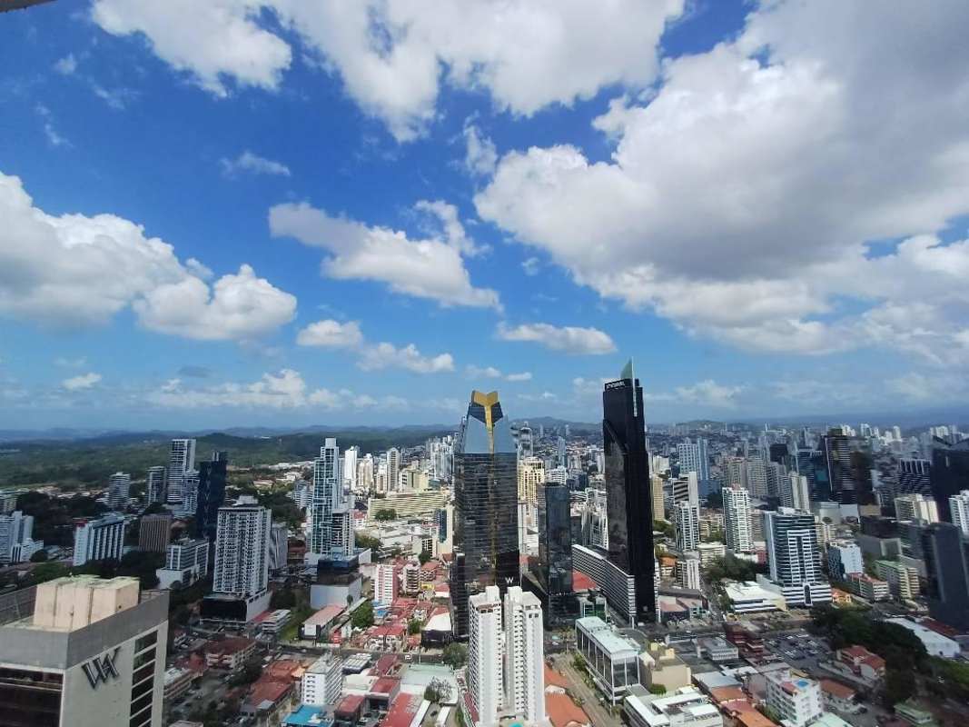 Luxury bathroom double vessel sinks, glass enclosed shower, marble finishes Yoo Panama penthouse