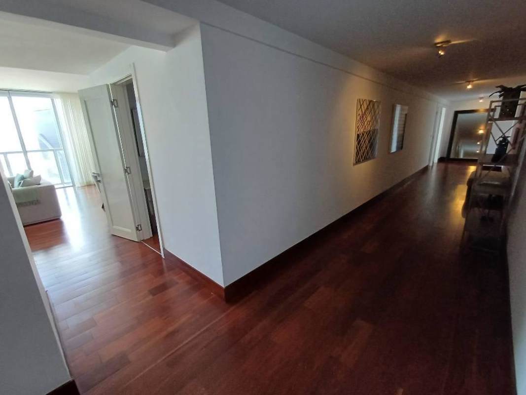 Master suite with king bed, ocean view, balcony access in Yoo Panama penthouse rental