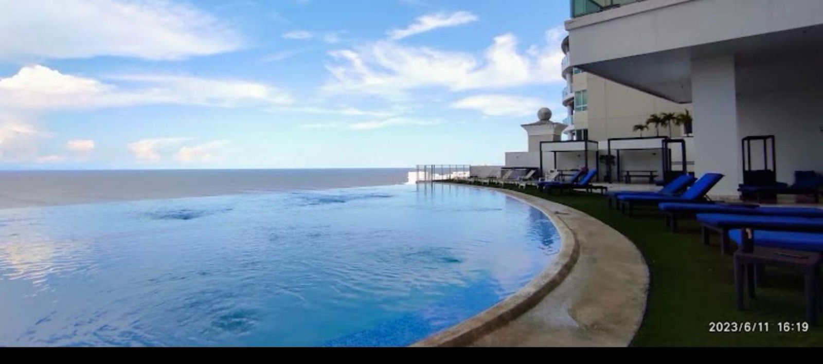 Spacious bright living room with floor-to-ceiling windows ocean view Punta Pacifica Panama