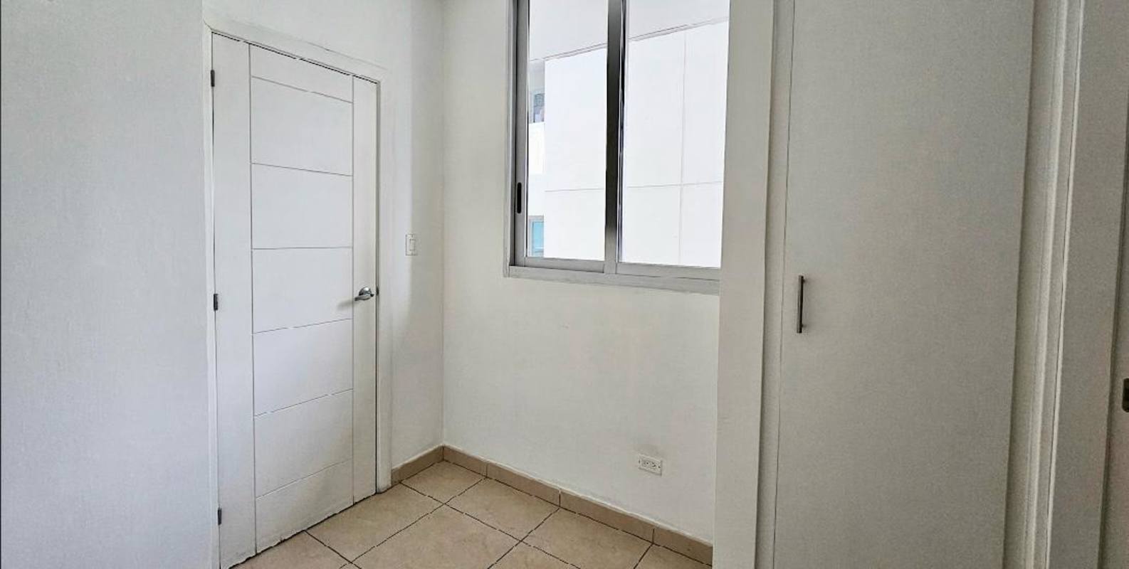 Luxury bedroom featuring large windows oceanfront view walk-in closet Punta Pacifica Panama