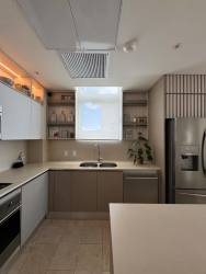 Remodeled open kitchen with island and stainless appliances in Marina Village Tower Buenaventura