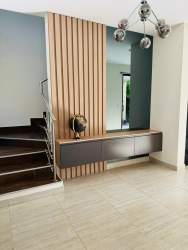 Modern closed kitchen with granite counters, sleek cabinetry, Residencial Nativa family home, Panama