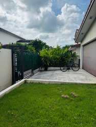 Green backyard space with dining patio, Residencial Nativa Panama Pacifico home