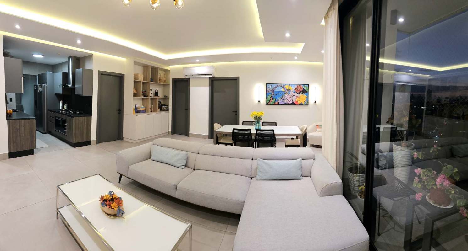 Bedroom with floor to ceiling windows overlooking Panama City