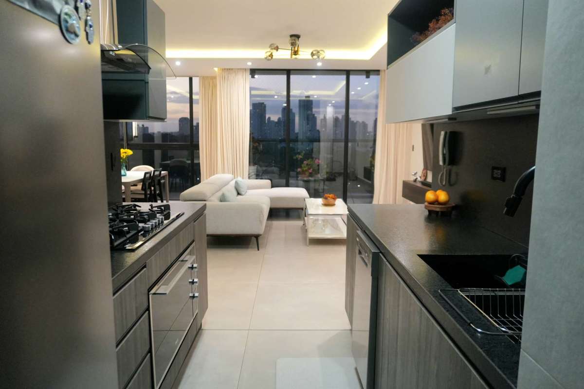 Fully equipped modern kitchen with granite countertops at PH Victory Sport