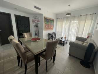 Modern bathroom with walk-in shower, glass enclosure and quartz vanity in Tucan apartment Panama