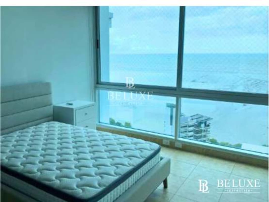 Spacious master bedroom with large windows and ocean view in PH Titanium Costa del Este Panama