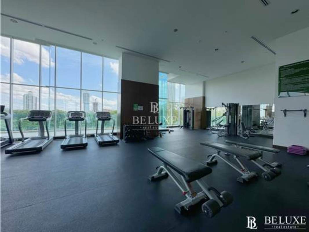 Modern outdoor communal patio with bar counter and pergola at PH Titanium Panama