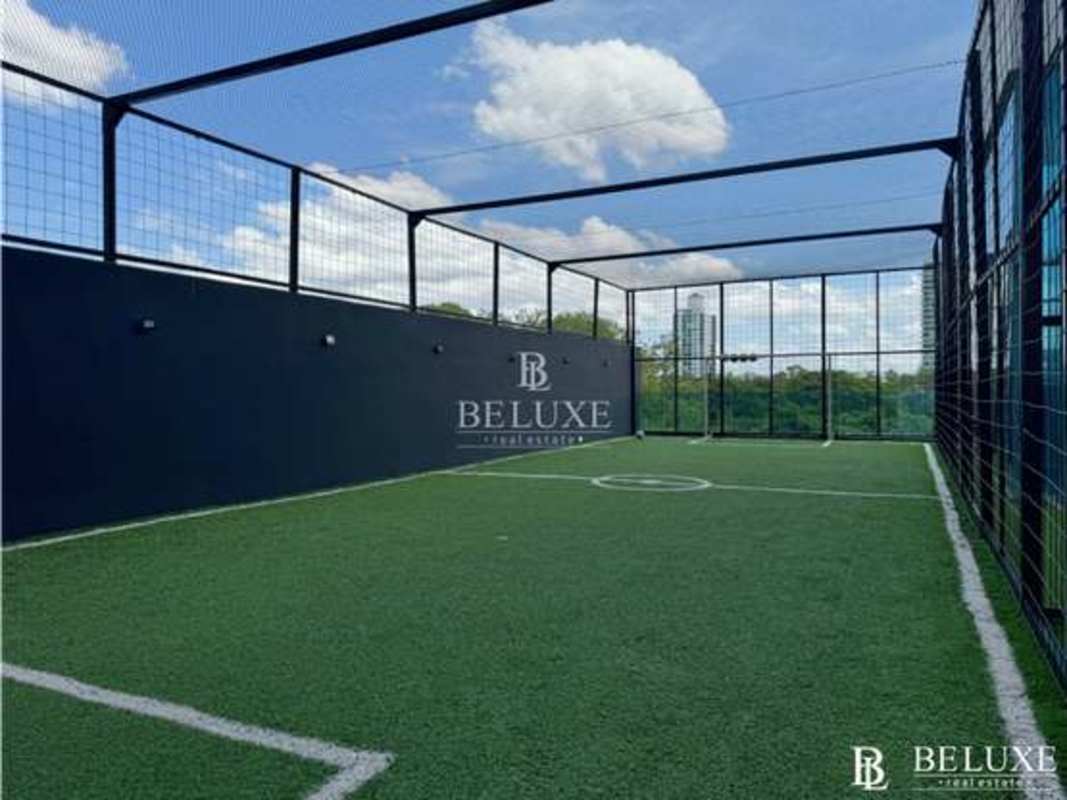 Covered BBQ area with dining tables and lounge space PH Titanium Costa del Este Panama