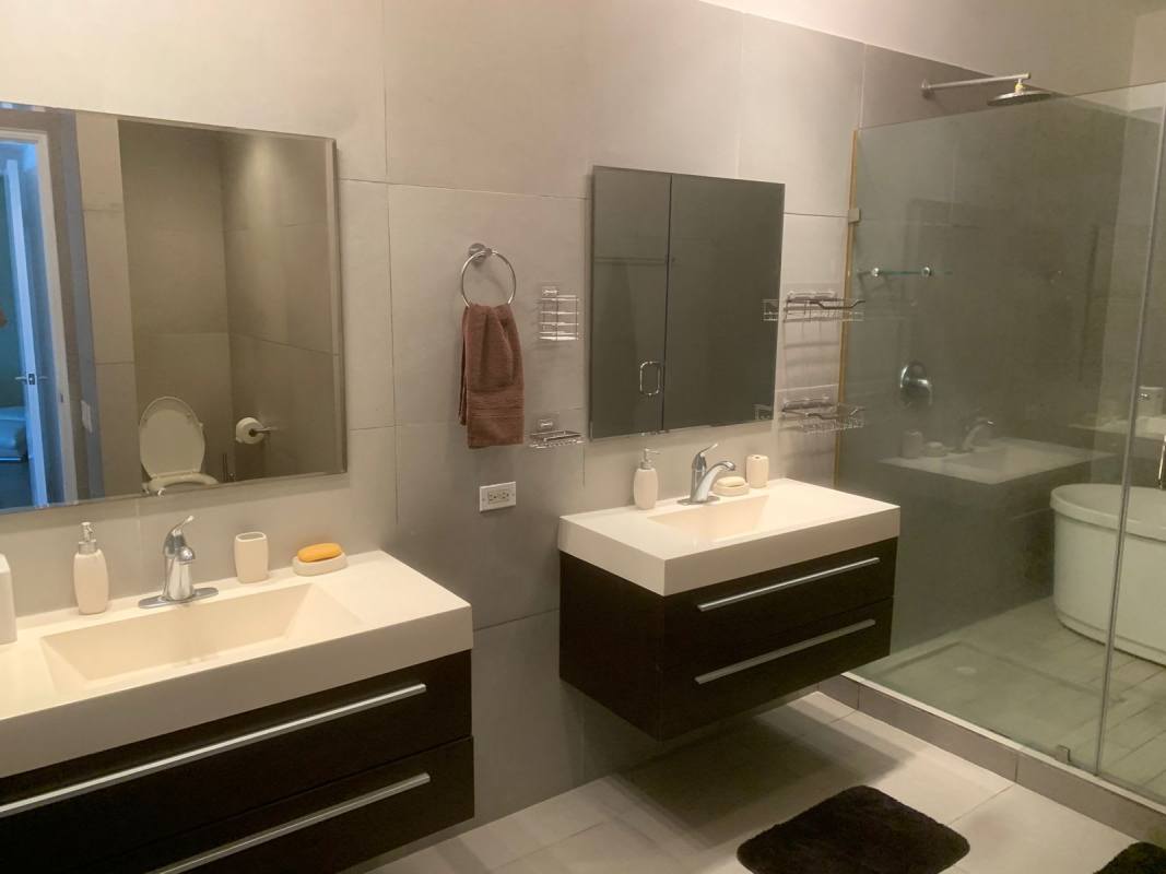 Luxury bathroom with glass shower and modern vanity PH Yacht Club Panama City