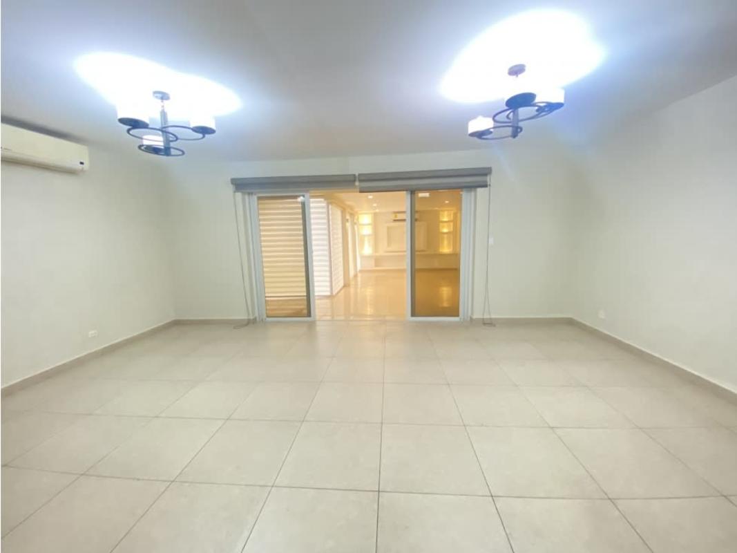 Spacious master bedroom with walk-in closet and balcony at Reservas de Versalles Panama