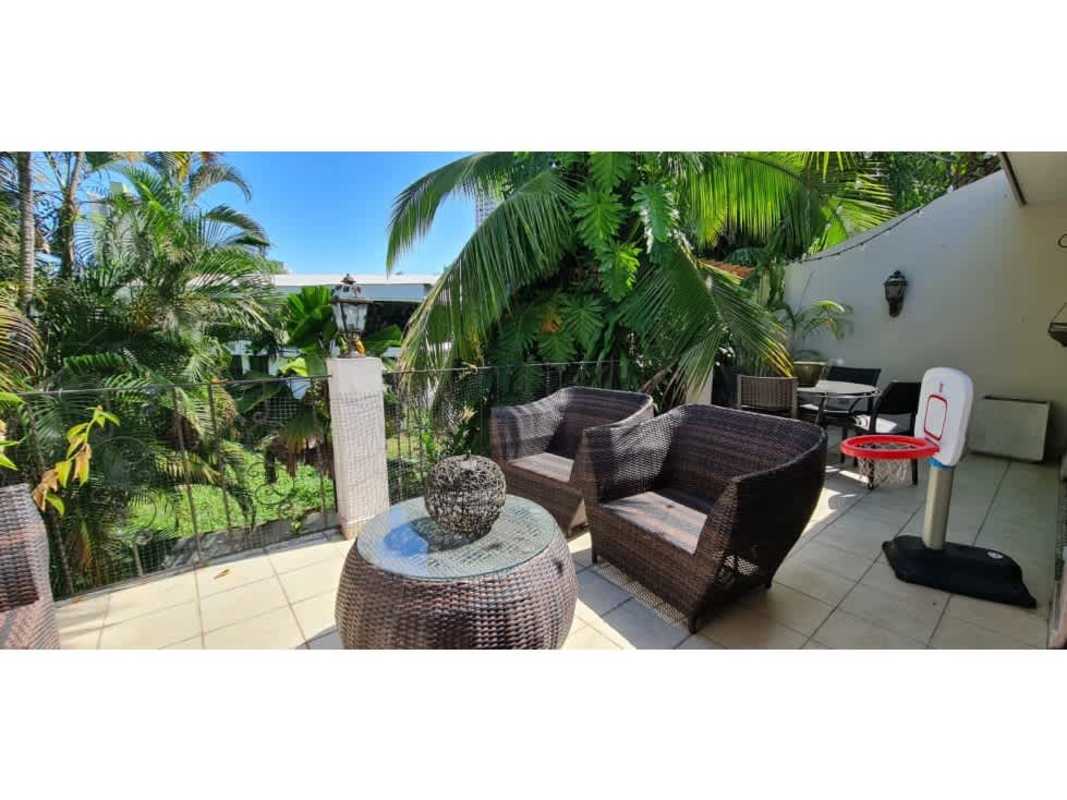 Spacious open living and dining area with ceramic floors and neutral decor in El Cangrejo home