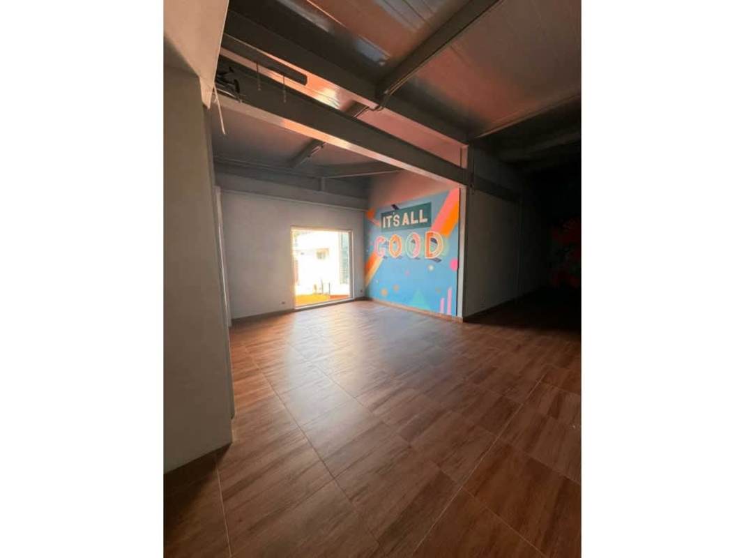 Lobby area with teal tile counter industrial ceiling wood flooring commercial property plaza Panama