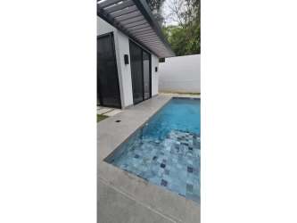 Spacious ensuite bedroom with walk-in closet and balcony in Explora Panama Pacifico