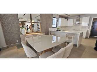 Modern open concept living room with large windows in Explora Panama Pacifico house