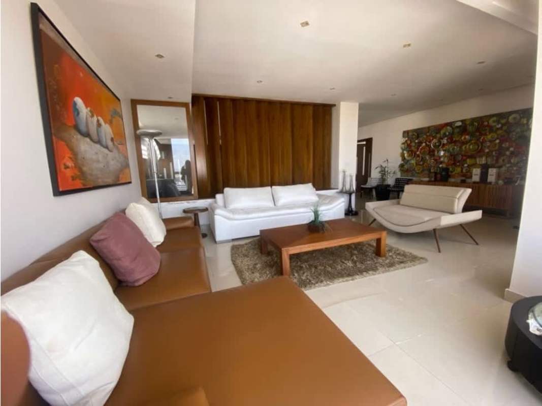 Stylish lobby lounge with abstract wall art, modern chairs and wood dividers PH Diana Towers Obarrio Panama City