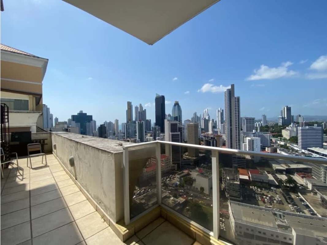 Modern dining space with glass table, large windows and city views in PH Diana Towers Panama City