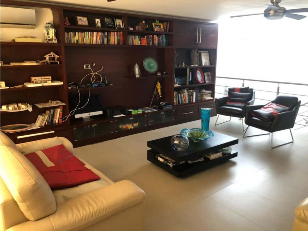 Large living room overlooking garden in luxury Obarrio home Panama City