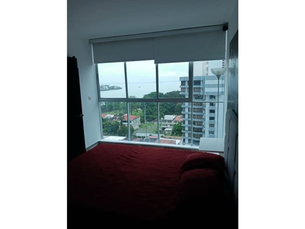 Living and dining area with balcony access at PH Ocean Club Tower furnished apartment Punta Pacifica Panama