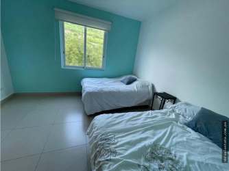 Bright bedroom with en-suite bathroom and AC in Bijao beachfront rental Panama