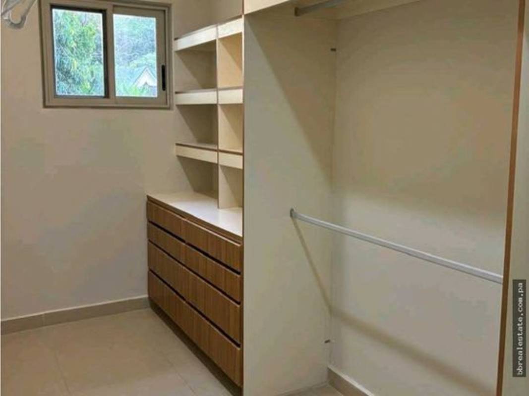 Spacious closet with wooden drawers and shelves walk-in style Panama rental house