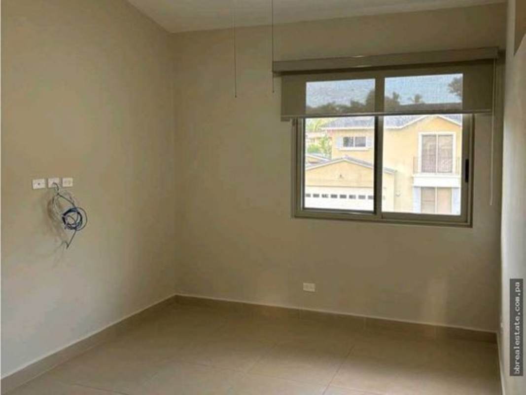 Large bedroom with beige walls, big window, tiled floor and AC embassy zone Clayton
