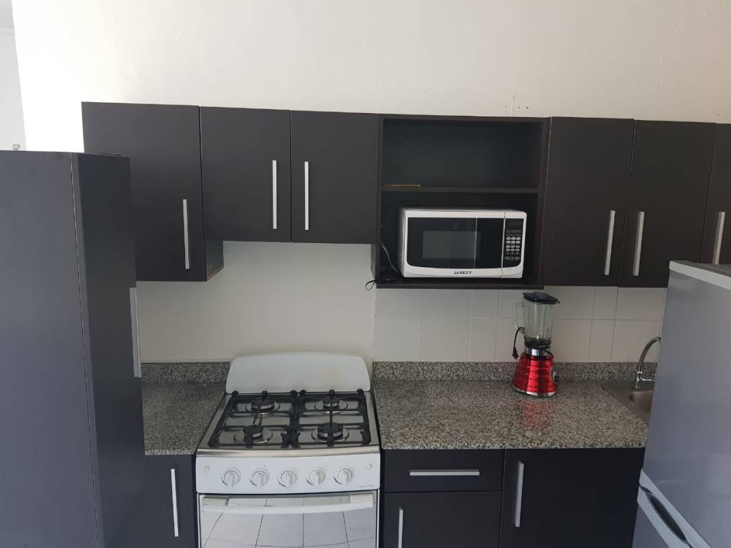 Atrium courtyard orange railings tiled floor seating PH Parques del Este Panama City