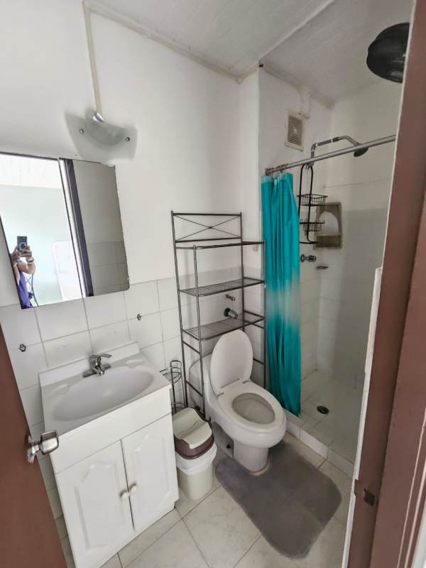 Living room with sofa dining set large windows PH Parques del Este Campo Limberg Panama