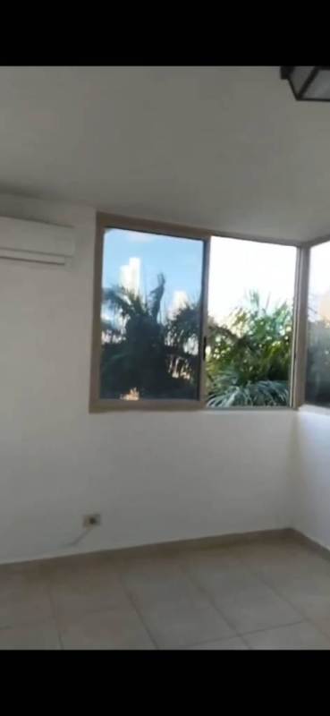 Bedroom featuring wall-mounted AC, city views, tile floors in PH San Francisco Bay Panama