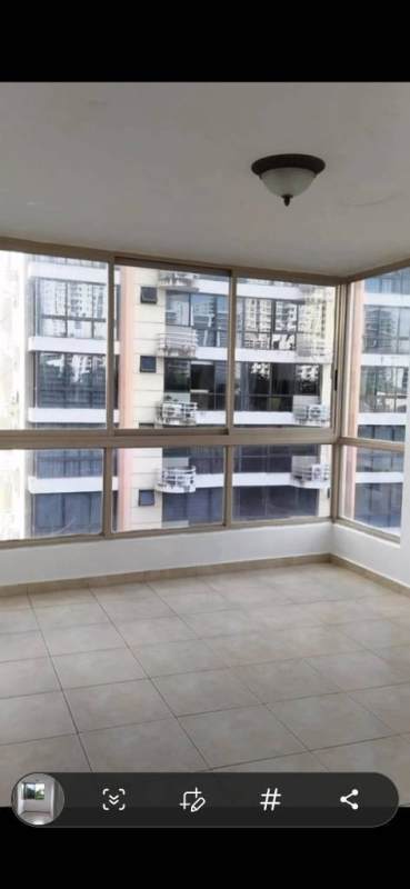 Sunroom with corner windows and views of Panama City high-rises in PH San Francisco Bay