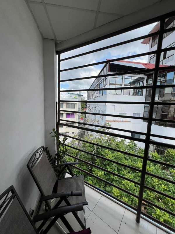 Apartment balcony with folding chairs and city skyline view PH Valentina El Ingenio Panama