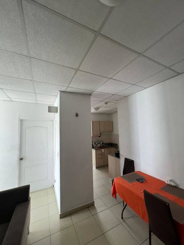 Empty bedroom with white walls, window with bars, tile floor in PH Valentina El Ingenio Panama