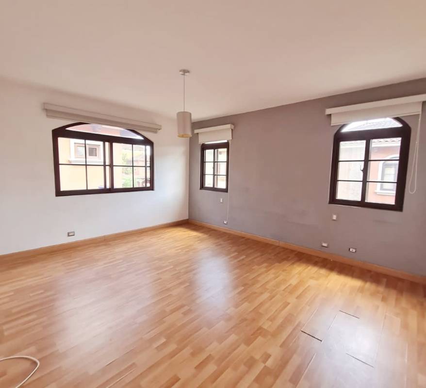 Bright living room with wood flooring, arched windows, neutral palette in PH El Doral Costa Sur Panama