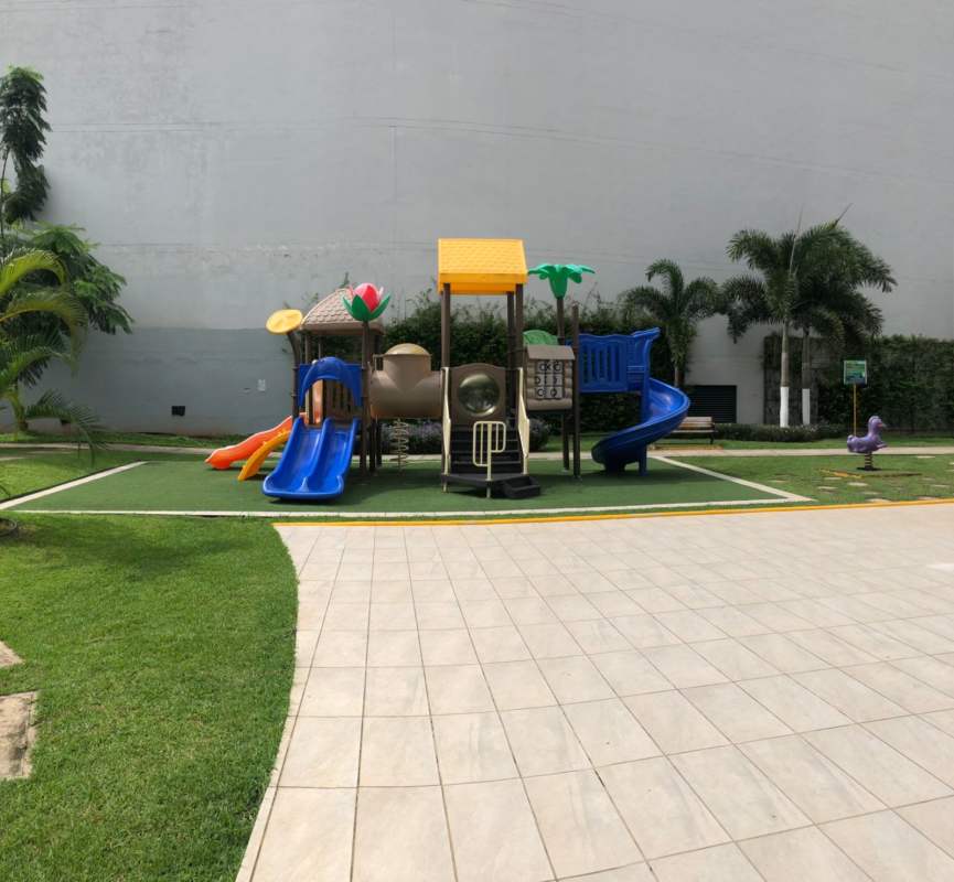 Children’s climbing and slide playground with green landscaping in PH Kings Park Panama City