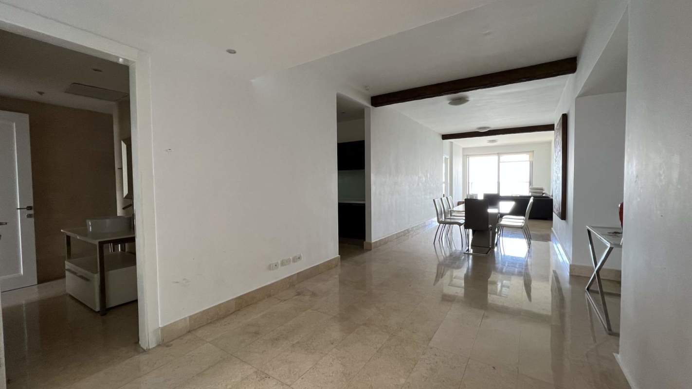 Modern living dining space with floor-to-ceiling windows and bay view at PH Yoo Panama