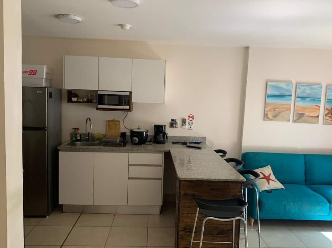 Living dining room with balcony access and ocean view in Playa Caracol Residences Panama