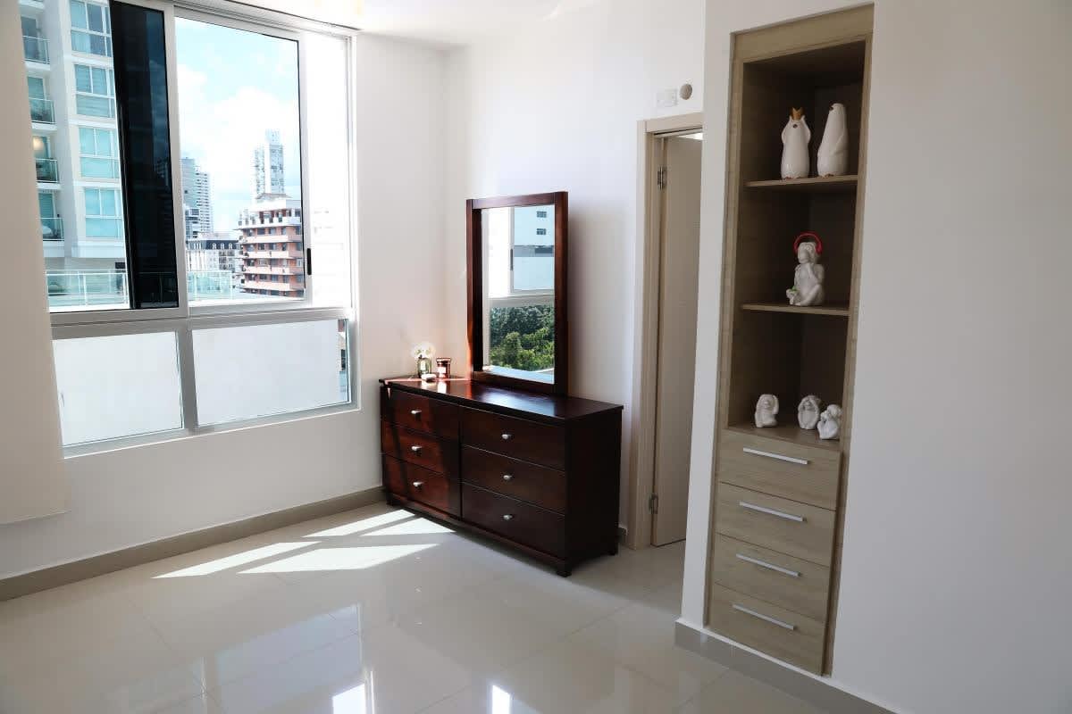 Spacious living dining area with access to balcony, city skyline view in PH Quartz Tower Panama