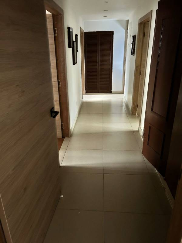 Modern dining area with lighting and mirror in PH Diplomatic apartment Panama