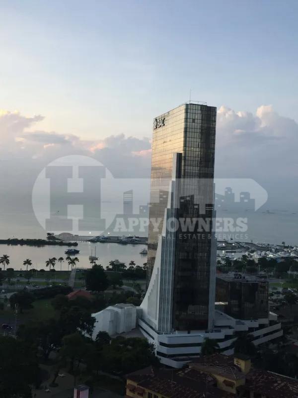 Lobby interior with dual elevators stone finish marble floors Torre BAC office tower Panama