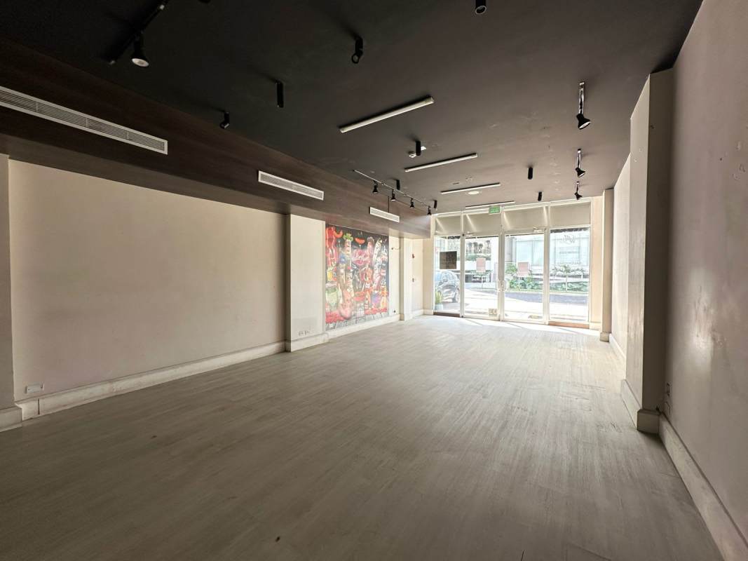Open commercial interior space with lighting and windows Plaza 66 Panama
