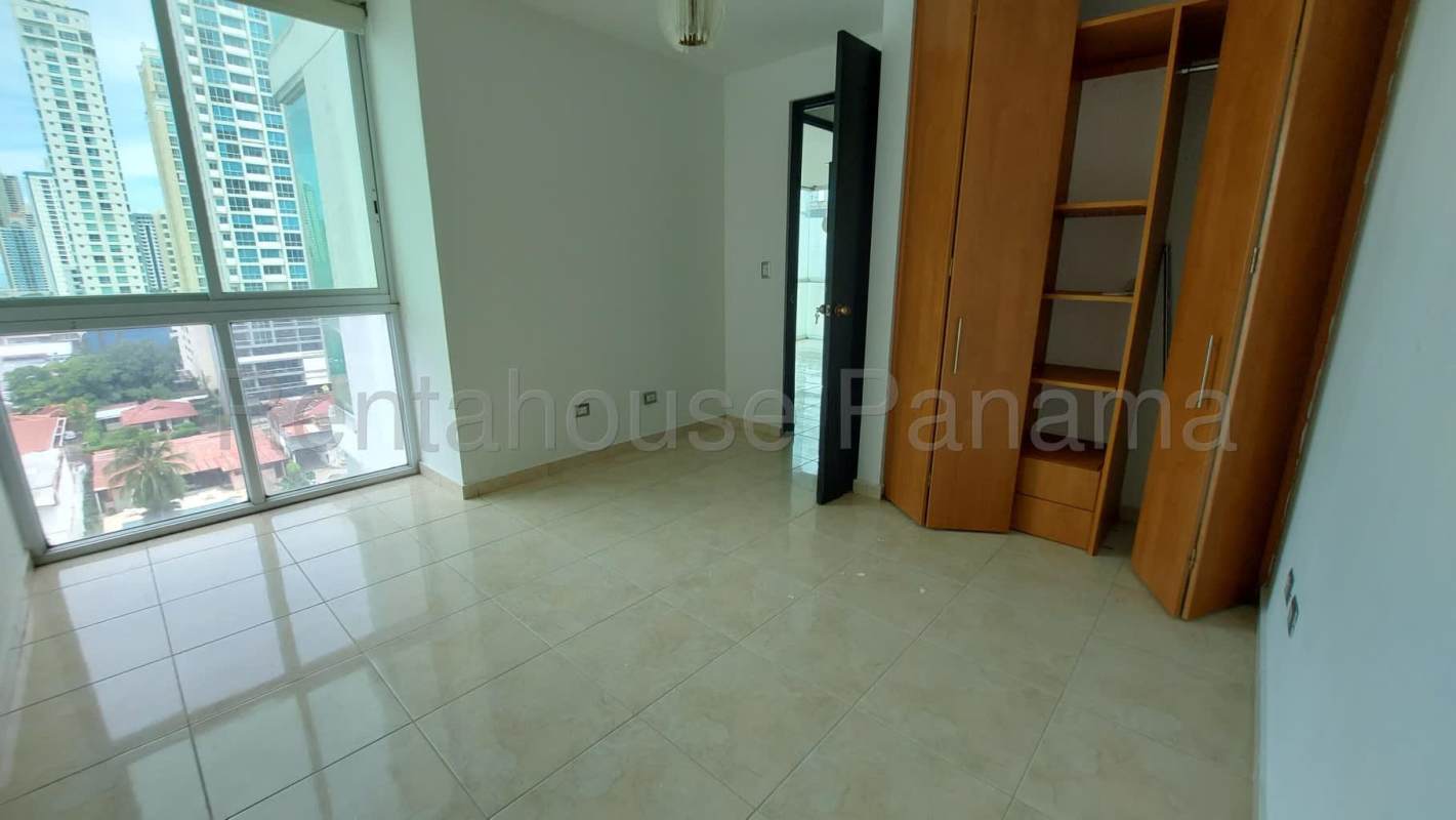 Contemporary kitchen granite countertops wooden cabinets window blinds Sky Blue Tower Panama City