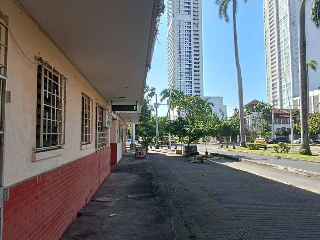 Street-facing commercial space with dual security doors and ample sidewalk Panama