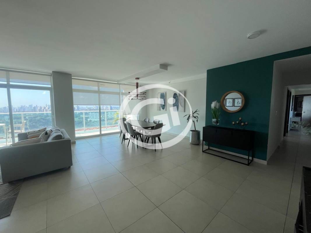 Spacious modern kitchen with dark wood cabinets, island and stainless appliances in PH Country Heights Condado del Rey