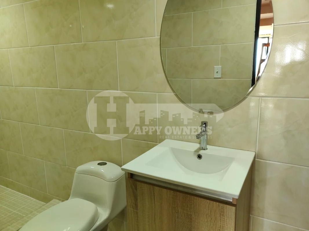 Reception space with accent wall and marble floors at Torre BAC office Panama City