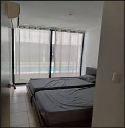 Minimalist bedroom with tile floors and large windows PH Ibiza Beach Villa Panama